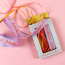 Geschenkband-Set „Schulkind“: Band 20mm in flieder mit Schrift in rosa und zwei Bänder 5mm rosa und gelb, je 3m